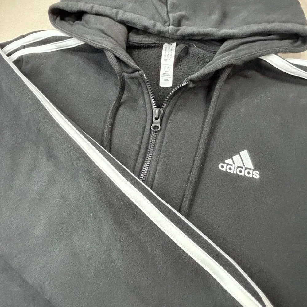 Adidas black zip up hoodie with white stripes on sleeves SZ M